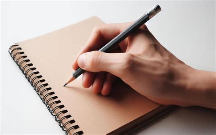 A blank notebook with a pen and coffee. A blank notebook with a pen and coffee.