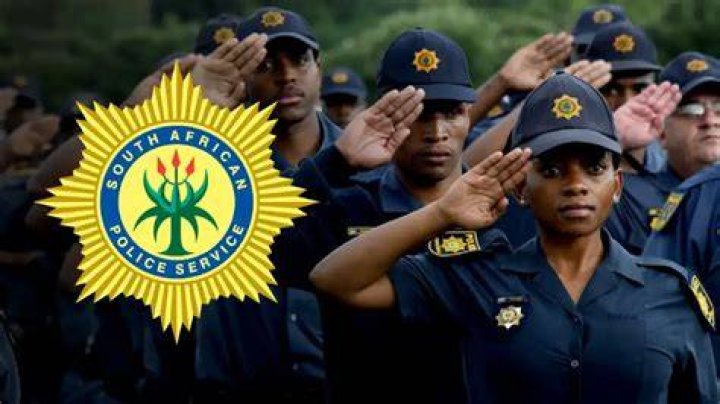 A South African Police Service (SAPS) officer interacts with a driver who's crossing from Zimbabwe into South Africa using the Beitbridge border post, near Musina A South African Police Service (SAPS) officer interacts with a driver who's crossing from Zimbabwe into South Africa using the Beitbridge border post, near Musina
