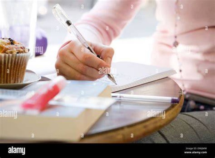 A woman writing in her notebook A woman writing in her notebook