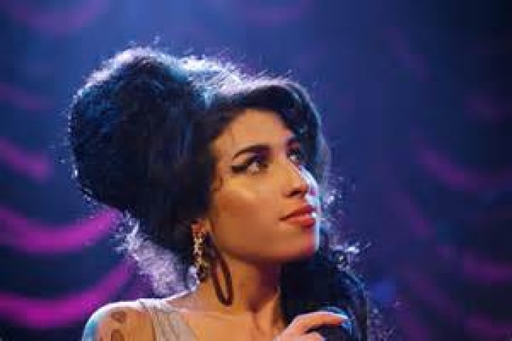 Amy Winehouse's exhusband says he 'cashed in' on her life after she