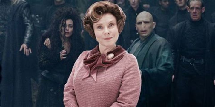 An image of Dolores Umbridge and a group of Slytherin students standing together in Harry Potter and the Order of the Phoenix