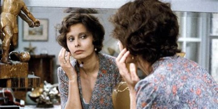 Antonietta looks in mirror in A Special Day