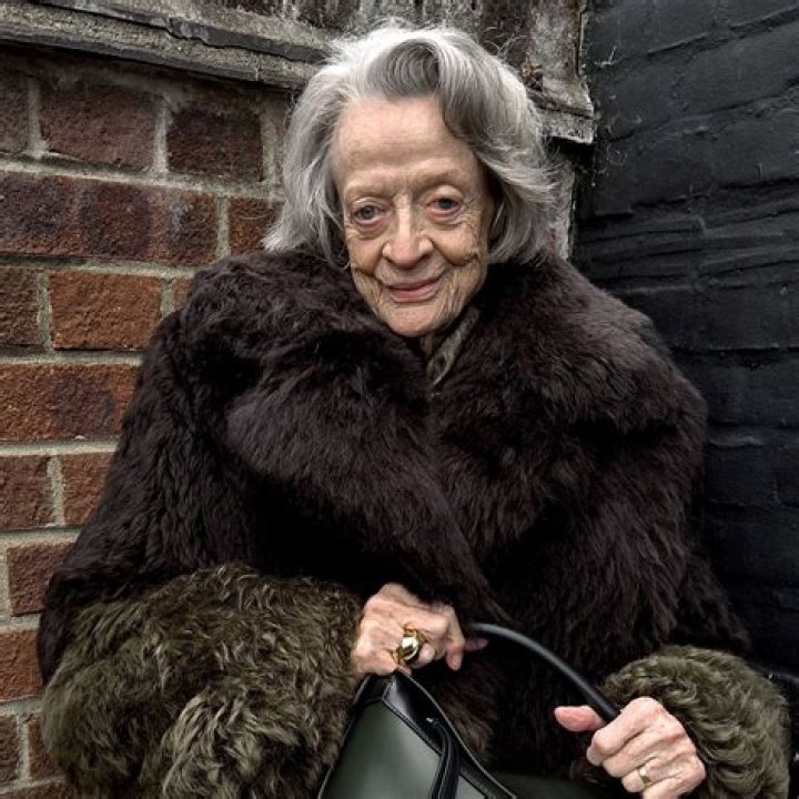 Dame Maggie Smith holding an umbrella in Evil Under the Sun