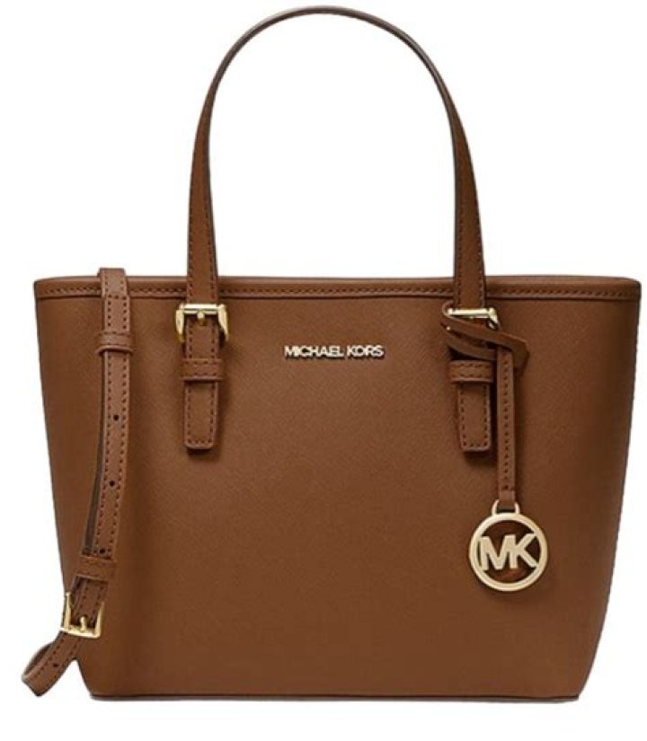 Designer Michael Kors doesn't stand quite as tall as a highheeled
