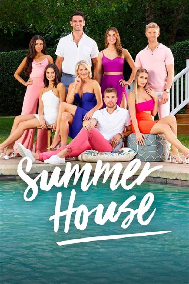 From Summer House, Hannah kissing Luke on the cheek as he smiles at the camera