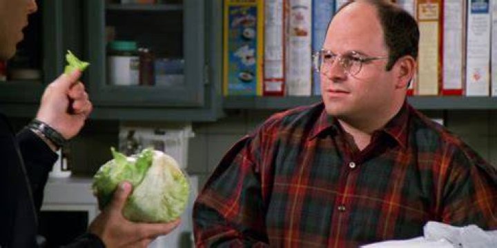 Jason Alexander as George looking suspiciously at Jerry in Seinfeld 
