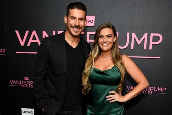 Jax Taylor from Vanderpump Rules posing in white shirt against white background