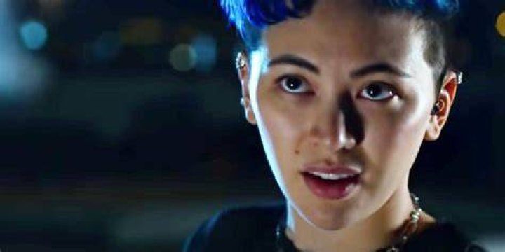 Jessica Henwick as Bugs with blue hair in The Matrix Resurrections