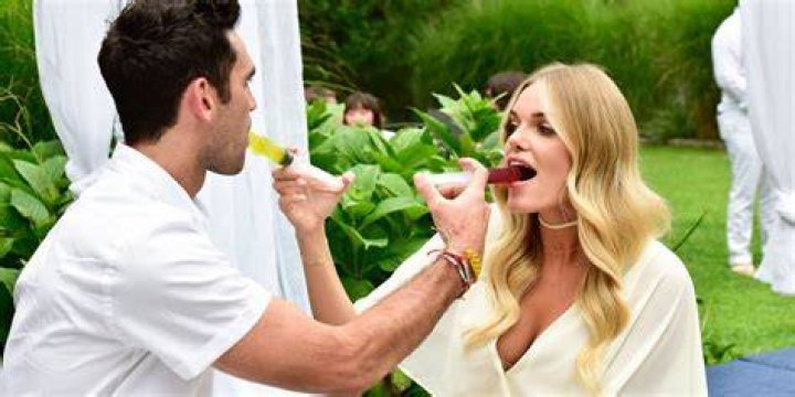 Lauren and Carl feed each other shots on Summer House