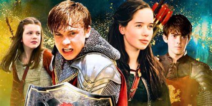 Lucy, Susan, Peter, and Edmund walk out of the trees in The Chronicles of Narnia.&nbsp;