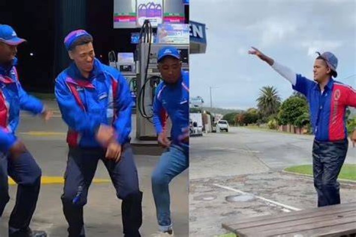 Man and petrol attendant dancing