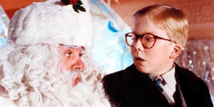 Peter Billingsley as Ralphie and looking at Santa in A Christmas Story