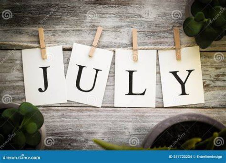 the word july written in red, white and blue fireworks